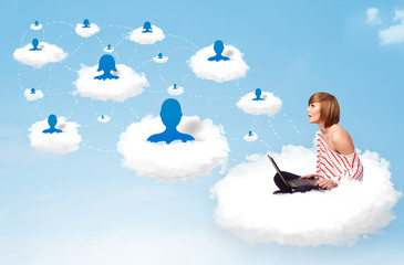 Young woman sitting in cloud with laptop