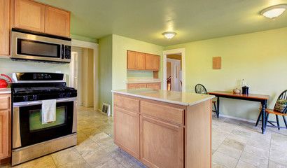 MInt kitchen room with light brown cabinets