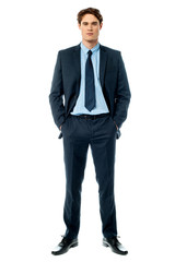 Young businessperson posing with hands in pocket