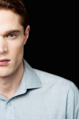 Fototapeta premium Half face portrait of a smart guy