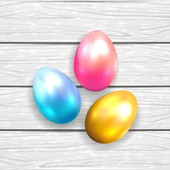 Easter eggs on white wooden background