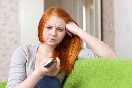 Red-haired  teenager girl  having disappointment