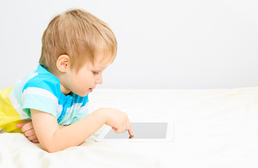 little boy with touch pad
