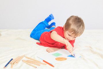 child drawing shapes