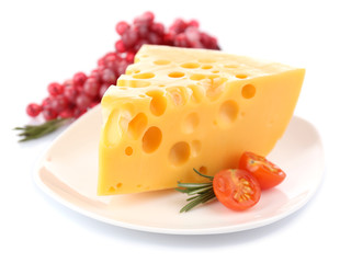 Piece of cheese with grape, tomato and rosemary