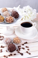 Set of chocolate candies on table on light background