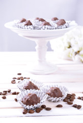 Set of chocolate candies on table on light background