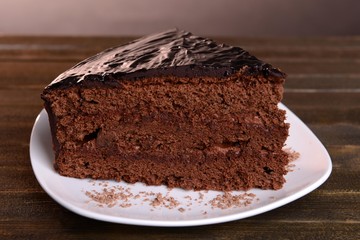 Delicious chocolate cake on table close-up