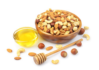 Sweet honey and different nuts, isolated on white