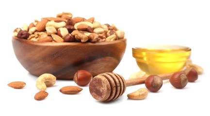 Sweet honey and different nuts, isolated on white