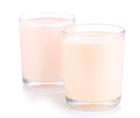 Delicious yogurt in glasses isolated on white