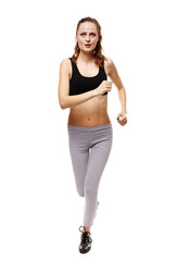 Athletic young woman doing jogging