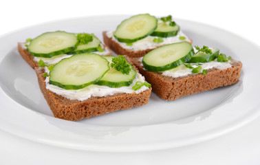 Delicious canapes on plate close-up