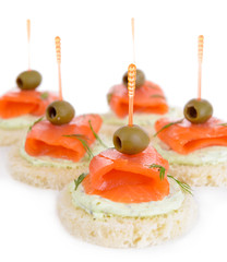 Delicious canapes isolated on white