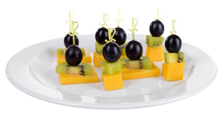 Delicious canapes on plate isolated on white