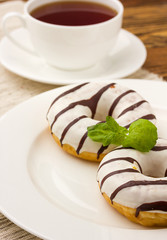 breakfast with donuts and cup of coffe