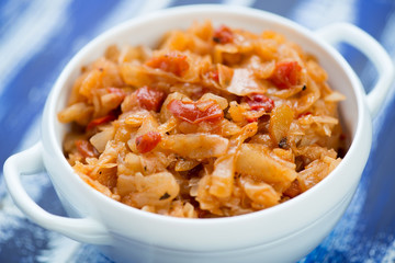 Glass bowl with braised cabbage, close-up