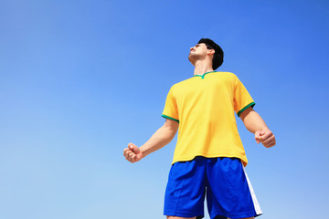 Fototapeta premium Excited man holding a brazil flag