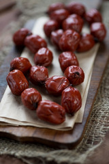 Close-up of smoked mini sausages, studio shot