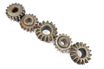 Old metal cogs isolated on white