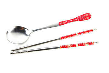 Stainless steel spoon and chopsticks with red pattern.