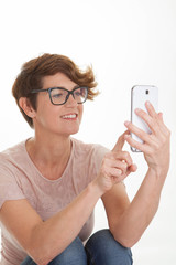 woman sending text from smart phone.