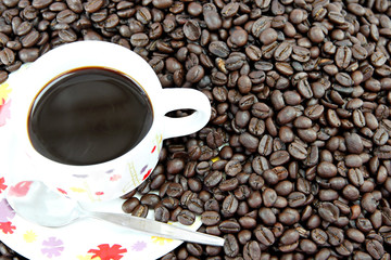 Coffee beans and white Cup.