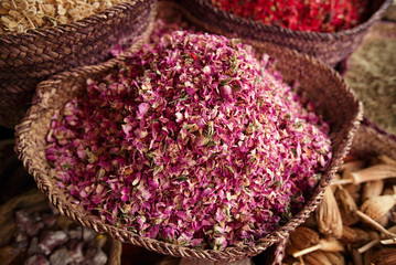spices herbs flowers (rose) in the Marrakesh street souk shop - obrazy, fototapety, plakaty
