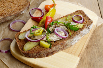 Sprat sandwich with pickled vegetables