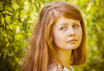 Fototapeta premium portrait of the rural red-haired girl