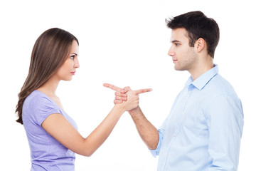 Couple pointing at each other