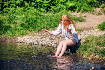rural red-haired girl  on the river