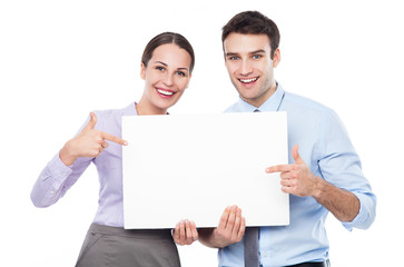 Business couple holding a placard