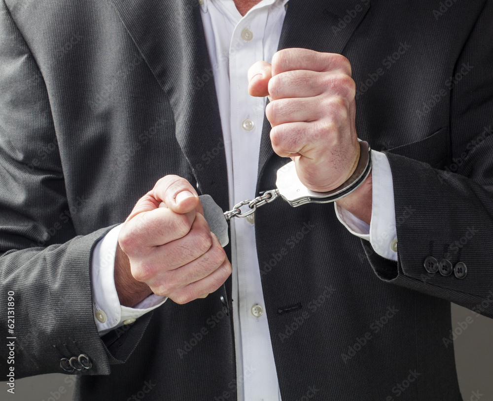 Wall mural corporate offense with man in handcuffs