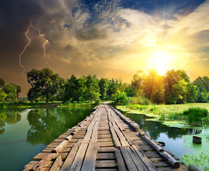 Lightning over the wooden bridge