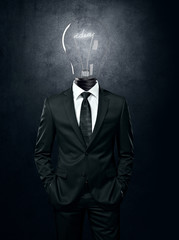Business man with light bulb instead head