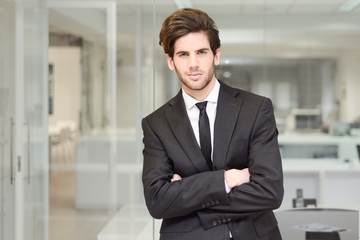 Handsome young businessman in an office