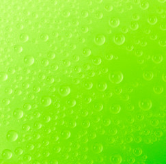 Water drop on color background