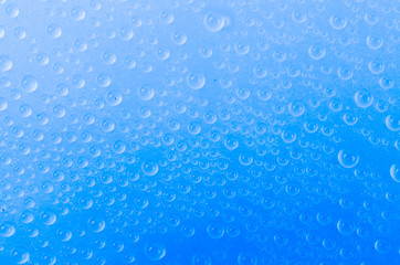 Water drop on color background