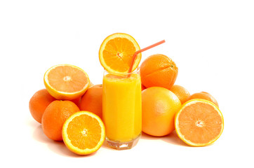 Citrus fruit with a glass of fresh orange juice.