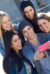 A group of friends taking photos with a smartphone