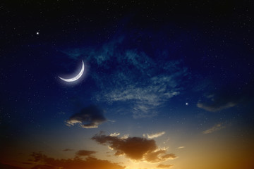 Fototapeta na wymiar Zachód słońca i księżyca