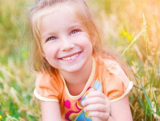 Cute little girl  on the meadow