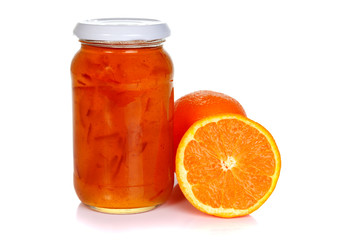 Fototapeta na wymiar Jar of orange marmalade and oranges