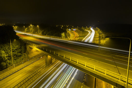 M25 Motorway at Night: Light Trails. © leegillion