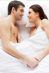 Obraz na płótnie Canvas Loving couple in bed.
