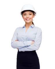 friendly smiling businesswoman in white helmet