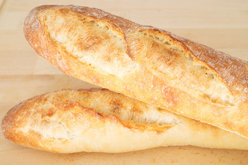French Bread Baguette on wooden cutting board