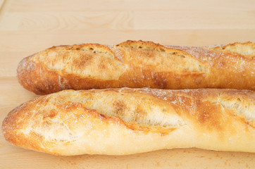 French Bread Baguette on wooden cutting board