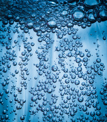 Oxygen bubbles in the bottle with water or drink.